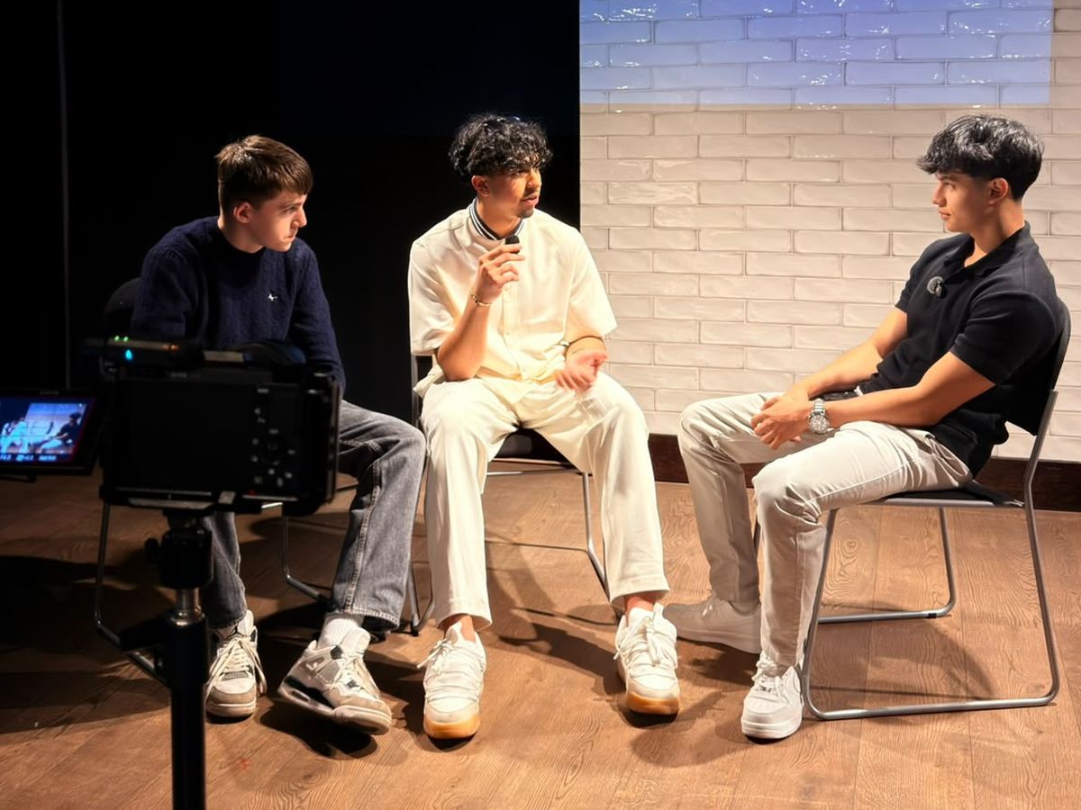 A filmed sit down conversation on stage